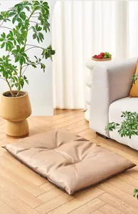 Modern waterproof faux leather dog bed mat placed in a bright indoor living room