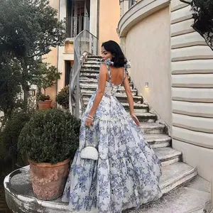 Elegant floral print organza maxi dress with ribbon straps and tiered skirt for summer