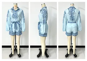 Detailed views of light blue long-sleeve shirt and shorts set with ornate blue print