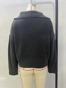 Detailed back view of a dark gray loose-fit vintage knit sweater with thick texture.