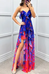 Detailed view of the vibrant floral print and tiered ruffle hem on a strapless mesh evening dress