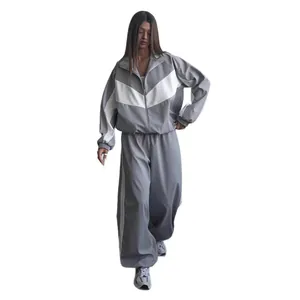 Fashionable women's loose grey tracksuit set with white chevron color block design