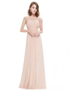 Full-length view of a peach lace evening gown for bridesmaids on white background