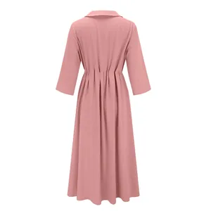 Back view of a pink cotton linen casual loose dress with elegant pleated waist detail