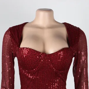 Macro detail view of a red sequin dress showing fabric texture and neckline
