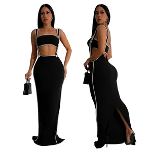 Front and side view of sexy black two-piece bodycon maxi skirt set with white piping