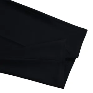 Close-up of black wide-leg jumpsuit hem showing high-quality stitching details