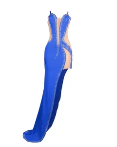 Detailed view of a sexy blue rhinestone mesh evening gown with a high slit.