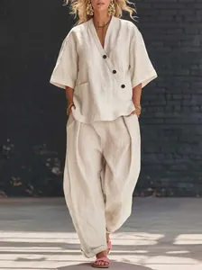 Elegant beige linen-blend two-piece set featuring a V-neck top and wide-leg pants