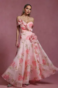 Detailed view of a pink French vintage floral maxi dress with elegant 3D flower accents.
