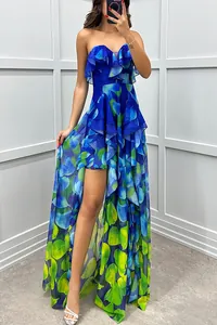 Detail of vibrant blue and green floral print mesh strapless maxi dress with ruffles.