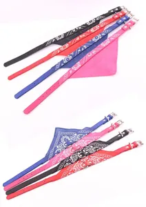 Detailed view of adjustable leather dog bandana collars with paisley patterns in four colors.