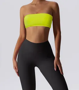 Detailed view of a neon yellow strapless sports bandeau bra with high waisted black leggings