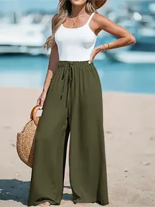 High-waist women's army green wide-leg trousers for a comfortable summer beach look