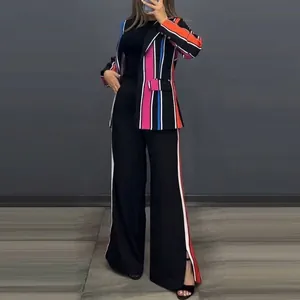 Detailed view showing the colorful striped blazer and side-stripe wide-leg pants set.