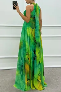 Side view of a sleeveless green floral halter maxi dress with back tie detail