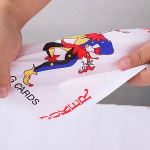 Close-up detail of durable crinkle squeaky dog toy featuring Joker playing card design