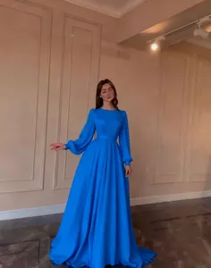 Elegant bright blue French style chiffon dress with puff sleeves and a long flowing skirt