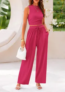 Detailed view of a vibrant magenta two-piece knit set with sleeveless top and wide-leg pants