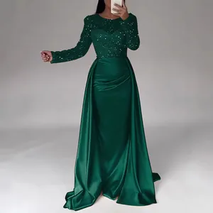 Elegant emerald green sequined evening gown with long sleeves and satin draped skirt