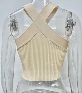 Detailed back view of a beige knitted halter crop top with elegant criss-cross straps