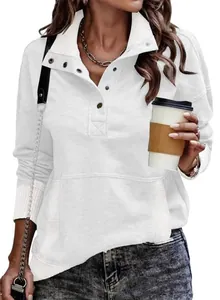 Detail view of white long sleeve sweatshirt featuring buttoned stand collar and pocket