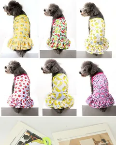 Selection of colorful pet dresses for small dogs with fruit and butterfly patterns
