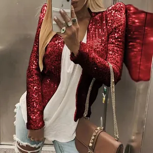 Detail of glamorous red sequin jacket with stand collar and shimmering finish