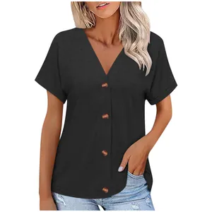 Detailed view of women's black V-neck short sleeve top with button accents