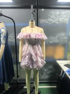 Elegant off-shoulder floral mini dress with ruffled layers, displayed on a mannequin.