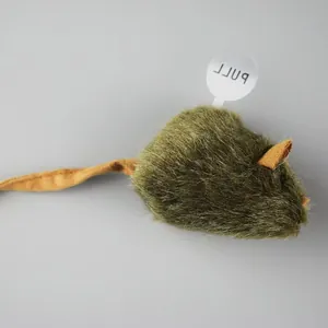 Macro detail view of a green fuzzy plush mouse cat toy featuring a white pull tab for activation