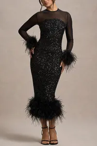 Detail of black sequined party dress with elegant feather trim and mesh sleeves