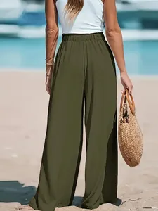 Macro view of olive green wide-leg pants fabric and high elastic waist detail