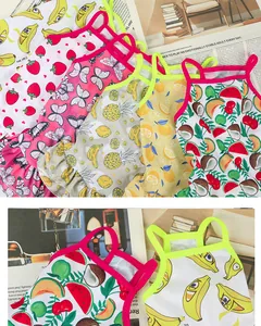 Close-up of vibrant fruit and butterfly patterns on summer pet camisole dresses.