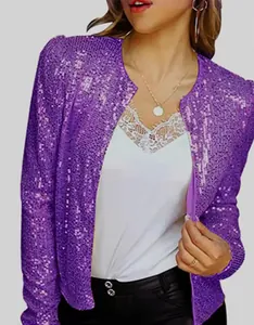 Close-up detail of a shimmering purple sequined cropped jacket with long sleeves for women