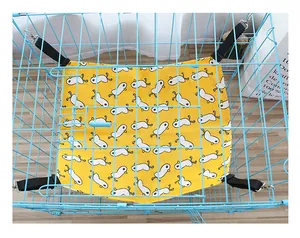 Detailed top view of a yellow cartoon cat hammock installed securely in a blue wire pet cage