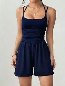 Stijlvolle marineblauwe zomerromper met spaghettibandjes en gerimpeld bovenlijfje