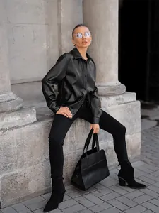 Stylish women's vintage black PU leather jacket with button-down design and lapel collar