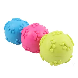 Close-up of colorful TPR dog squeaky balls with paw print texture for teeth cleaning
