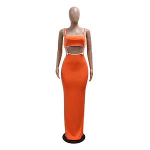 Vibrant orange two-piece set featuring a cropped tube top and suspender maxi skirt