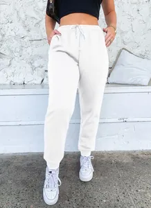 Close-up of white high-waisted drawstring sweatpants for a casual sporty look.