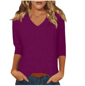 Close-up view of the purple V-neck and three-quarter sleeve details on this women's casual top