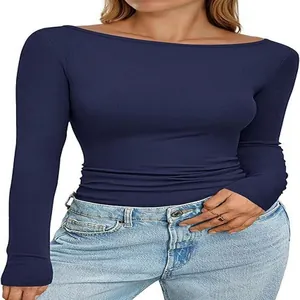 Close-up of women's navy boat neck ribbed knit slim fit long sleeve top.