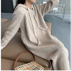 Detailed view showing the loose fit and ribbed knit texture of the hooded sweater dress