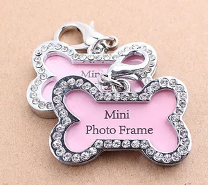 Macro view of bone-shaped dog tag with sparkling rhinestones and lobster clasp