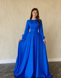 Elegant royal blue pleated evening gown with long sleeves and full chiffon A-line skirt