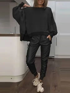 Casual black round neck sweatshirt with side slits and matching slim-fit joggers set