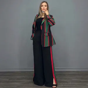 Elegant women's two-piece suit featuring red and green striped blazer and wide-leg pants.