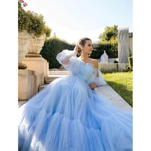 Elegant light blue off-the-shoulder tulle ball gown with puffy sleeves detail