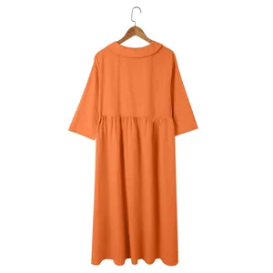 Back view of orange casual cotton linen dress with high waist pleated skirt detail.